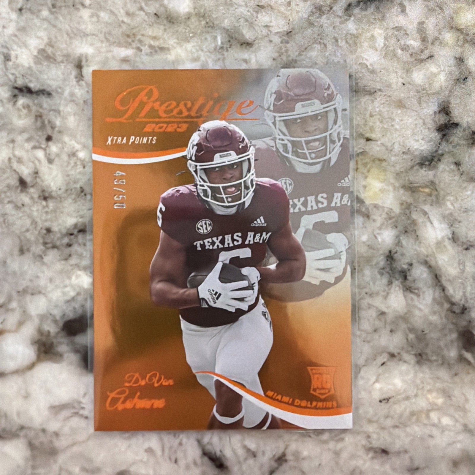 2023 Panini Prestige – Rookies De’Von Achane #328 Xtra Points Orange /50 (RC)