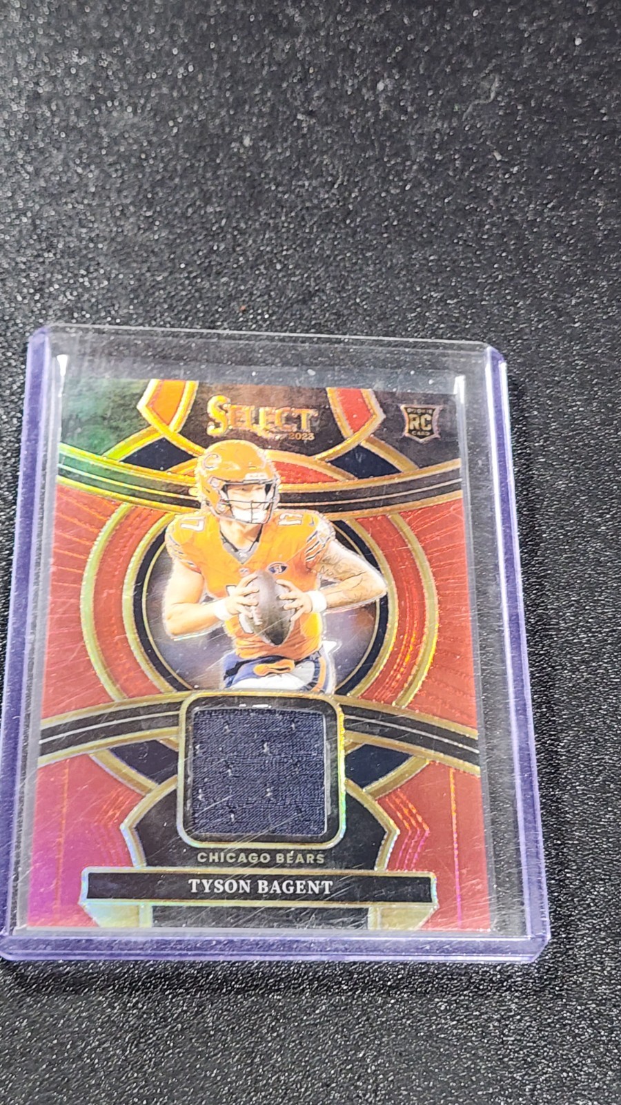 2023 Panini Select – Rookie Swatches Tyson Bagent #RSW-TBA Red Prizm (MEM, RC)