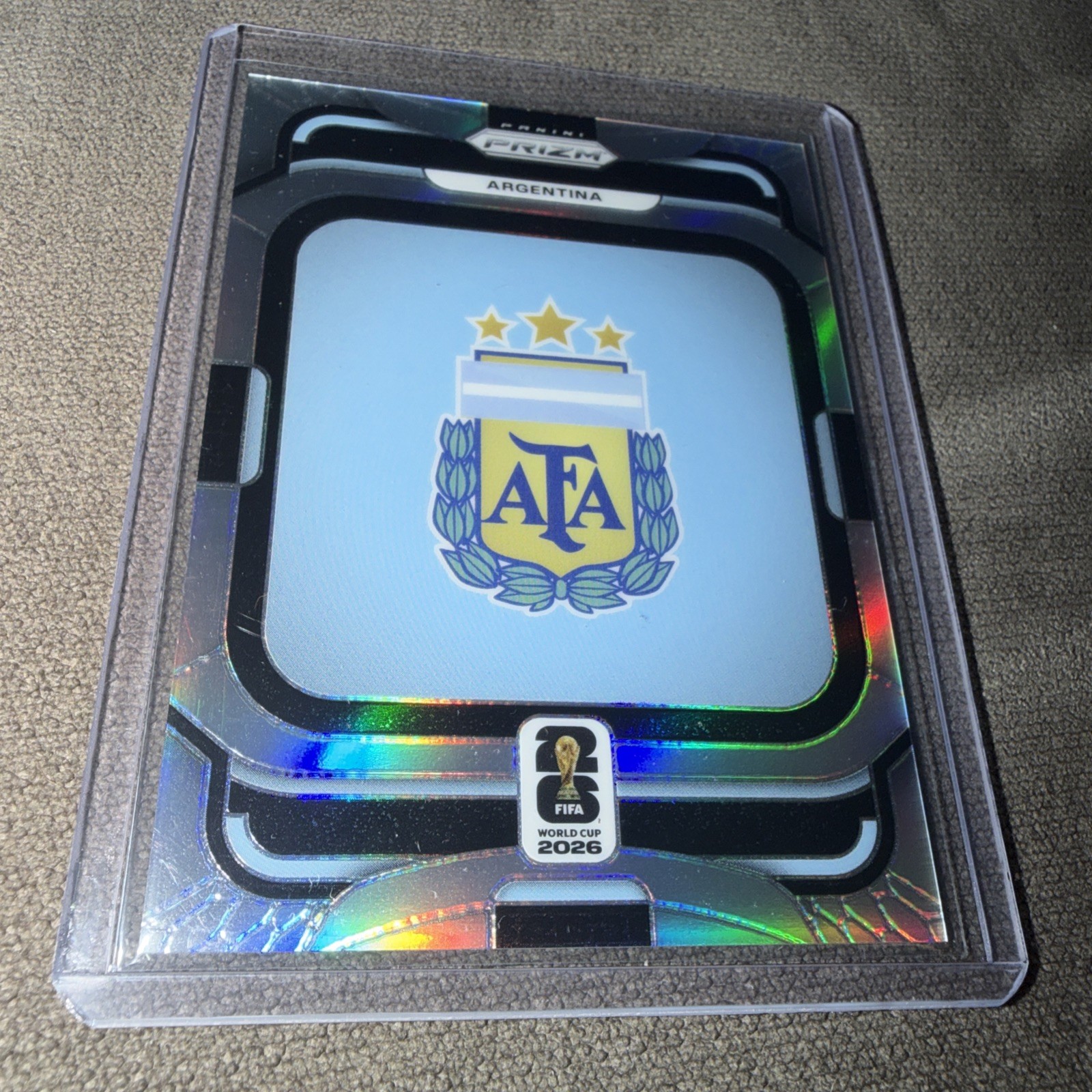 2026 Panini Prizm FIFA World Cup Argentina Team Badge Silver Prizm SP #3 AFA